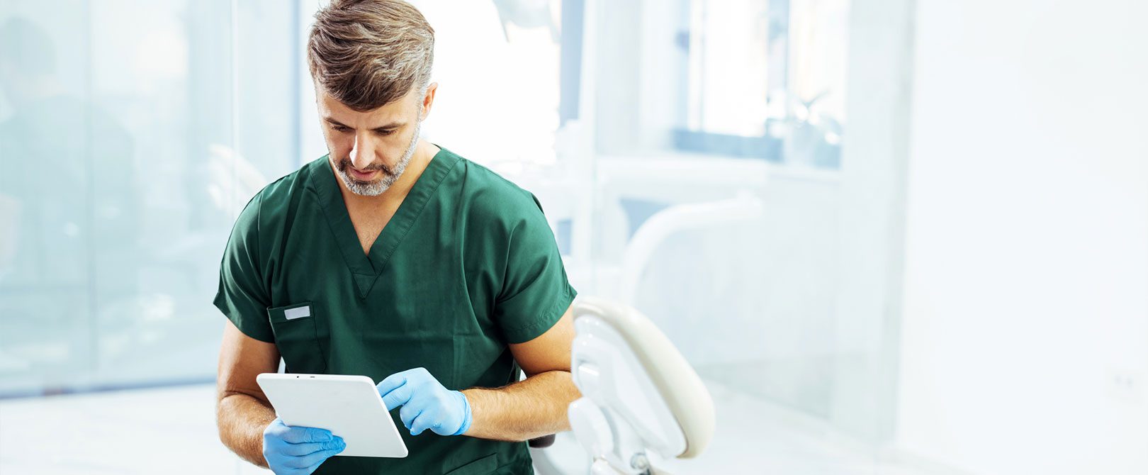 dentist on tablet
